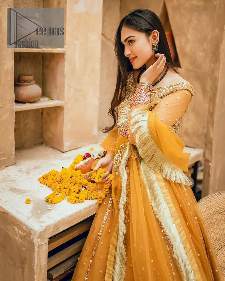Mustard is just associated and boosts your Mehandi. Presenting a dreamy mustard frock with a heavily embroidered bodice on a