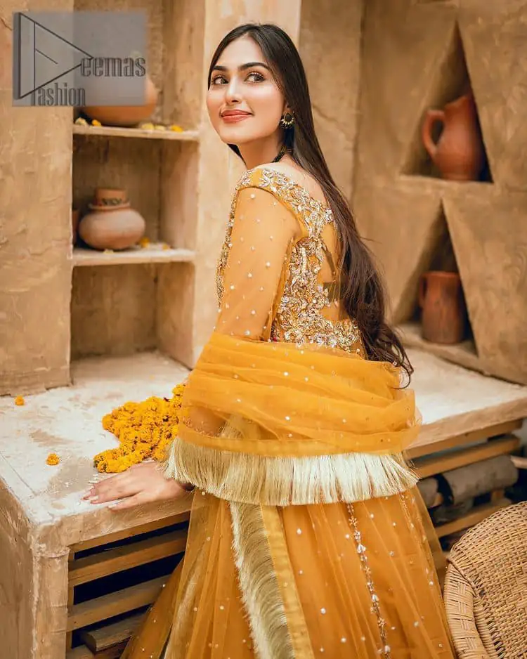 Mustard is just associated and boosts your Mehandi. Presenting a dreamy mustard frock with a heavily embroidered bodice on a