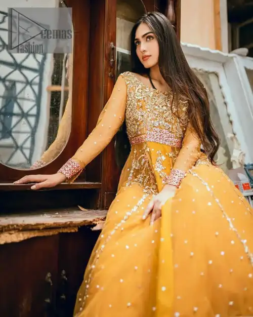 Mustard is just associated and boosts your Mehandi. Presenting a dreamy mustard frock with a heavily embroidered bodice on a