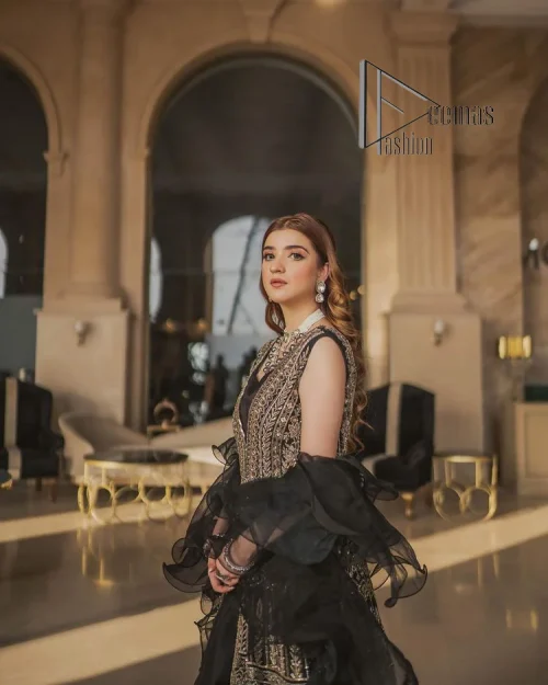 Wear black in-depth to lead colourful lives. DeemasFashion presents black party wear which includes a front open maxi having light