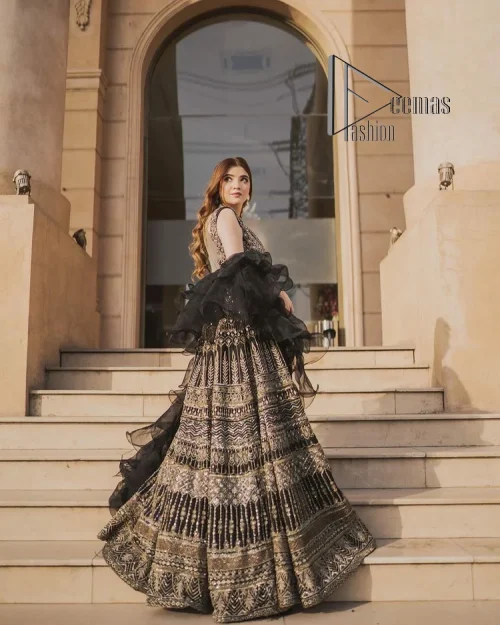 Wear black in-depth to lead colourful lives. DeemasFashion presents black party wear which includes a front open maxi having light