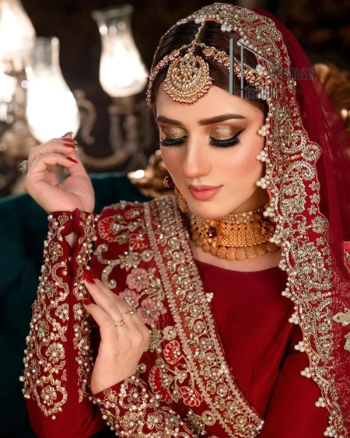 There is a shade of deep red for every bride. This Pakistani reception article begins with a deep red blouse