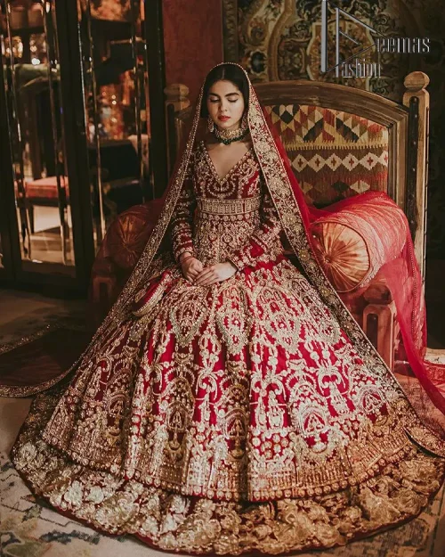 Deep red on Big day is just associated with love and romance. The deep red panelled frock is beautifully decorated