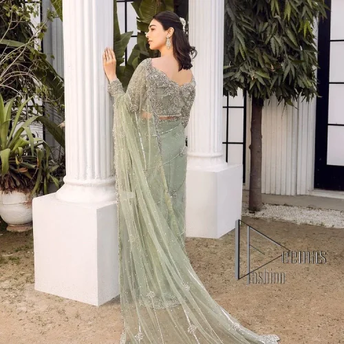 You go girl. Get you a handsome outfit that will wear matching robes. DeemasFashion presents this pistachio green saree to