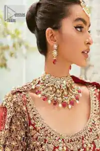 Vibrant outfit to make your reception day more shiny and bright. DeemasFashion presents this maxi in deep red colour, featuring golden embroidery which is enhanced with tilla, dabka, kora, naqshi, zardozi and the magic of Resham. The following scalloped front open maxi has a Round neckline to meet the traditional look when comes with three-quarter sleeves.  In addition to this, it is paired up with a back train lehenga in the same colour framed with embroidery on the border. Complete this article with a scalloped dupatta which is adorned with four-sided borders and sequins sprayed all over for sun-kissed splendour!