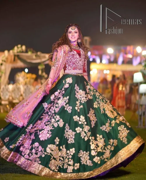 A combination of red and green are here to win hearts at your Mehndi. The attractive lehenga in green colour