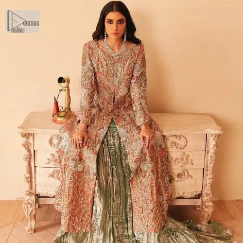 The latest elegant embroidered maxi in peach colour with magnificence embroidered work. The front open maxi is attractively laden with