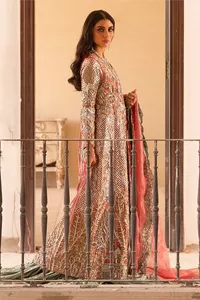 The latest elegant embroidered maxi in peach colour with magnificence embroidered work. The front open maxi is attractively laden with light golden embroidery to make this masterpiece unique and charming. Purely balanced raw silk maxi is presented with an ethereal blend of Resham, naqshi, kora, dabka and Mukesh carved with stones. Full Sleeves of the following maxi are also heavily embroidered. The round neckline gives it a magical look. It is coordinated with crushed lehenga in a pistachio green colour to create a ravishing Nikkah bride look. This crushed lehenga is paired with embroidered dupatta detailed with a splash of sequins and embroidered borders.
