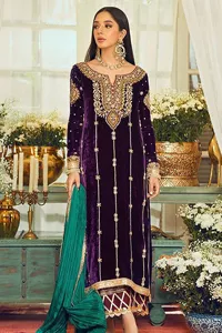Dress yourself up in glamorous ensembles. DeemasFaashion presents this beautiful party outfit in plum colour. It is highlighted with golden embroidery which is further enhanced with tilla, dabka, kora, Kundan and the real magic of zardozi. The full sleeves are embellished with sequins spray and floral motifs. In addition to this, the embroidered neckline makes this outfit more pretty. It is paired with maroon trousers with beautiful and stunning borders to balance the article. Complete this article with a dupatta in green and plum colour to fulfil the aesthetic look. 