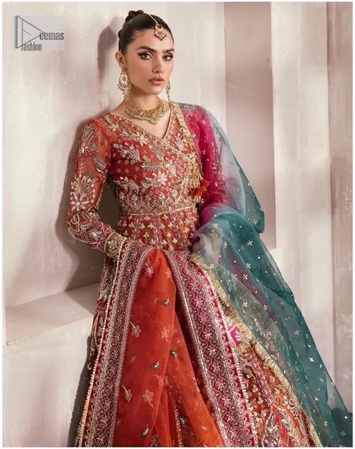 This deep rust outfit with a floral pattern has you covered for your big day. This deep rust angrakha is