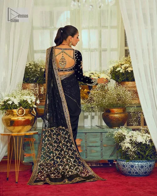 Black, is a reminder to love yourself. The navy blue blouse is augmented with elusive dabka and remarkable naqshi to