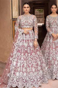It’s regal, it’s rich, it’s festive. This magnificent nikah outfit is hand-embellished with luxury designs and beautiful silverwork which is highlighted with tilla, dabka, kora, Kundan and details of Zardozi. The boat shape neckline making this attire your foremost priority to wear on the most important day of your life. Further, the full sleeves of the blouse also decorated with beautiful embroidery It is coordinated with scalloped lehenga which is heavily embellished. Intricate designs and fine details of lehenga give a perfect finishing look to this masterpiece. Complete this outfit with dupatta in the same colour. The dupatta is in delicate heavy embellished border gives an exquisite look to the gorgeous bride. The scalloped borders of this dupatta give a stylish touch to this outfit.