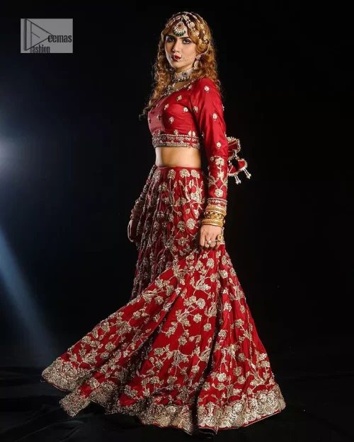 Reception called, and red answered. The stunning blouse is embellished with floral motifs. The base colour used for choli is