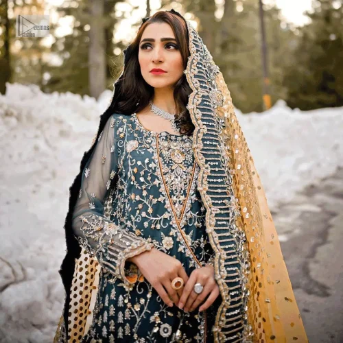 Crafted with silver and multiple shades of embroidery which includes tilla, dabka, kora, Kundan and the real magic of Zardozi,