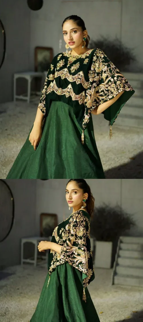 Style. Warmth. Performance & versatility! This stuns in a beautifully handcrafted green top enshrined with light golden embellishment and detailed