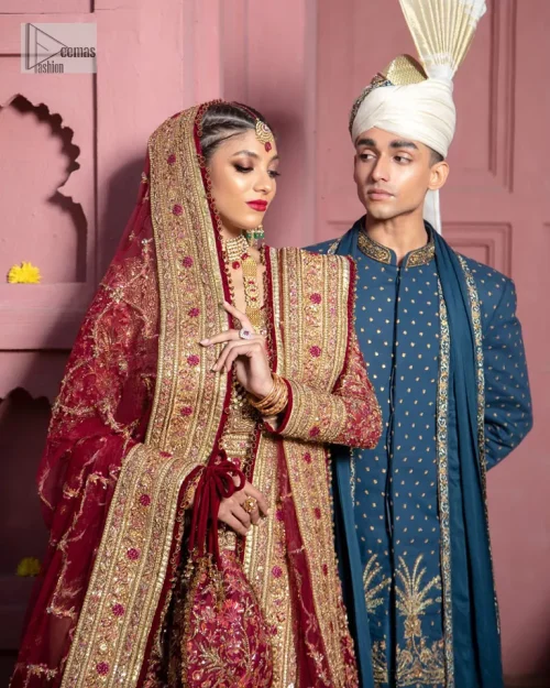 Deep shades of this reception wear just to brighten up your days. The deep red frock is intricately emblazoned with