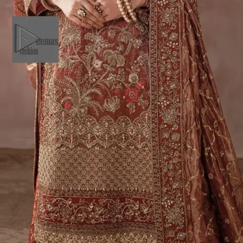 Red took the call from reception. Stunning floral patterns are used to decorate the long shirt.