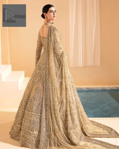 The front open maxi in an alluring gold shade is beautifully adorned with hand-crafted silver and gold embellishments.