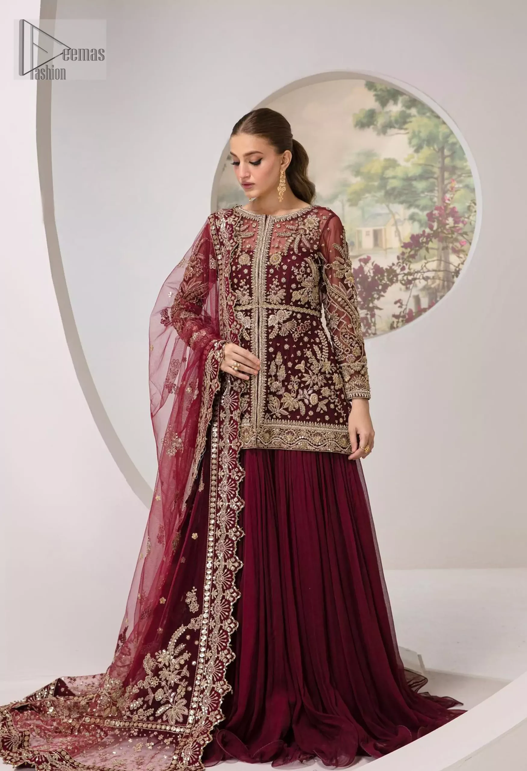 You are introducing our Maroon Party dress, a true embodiment of purity and simplicity for your special ceremony. This elegant ensemble is thoughtfully designed with dark antique shades of embroidery which involves tilla, dabka, Kora, Kundan and minimalist silhouette, allowing your natural beauty to shine on this sacred occasion. Crafted from the finest fabrics, it is organized with an inner maxi, giving you grace as you exchange your vows. The classic heavy dupatta in the same colour symbolizes the essence of the event, while delicate embellishments add a touch of sophistication. Make your union even more memorable with our party wear, perfectly tailored to honour the solemnity of the moment.