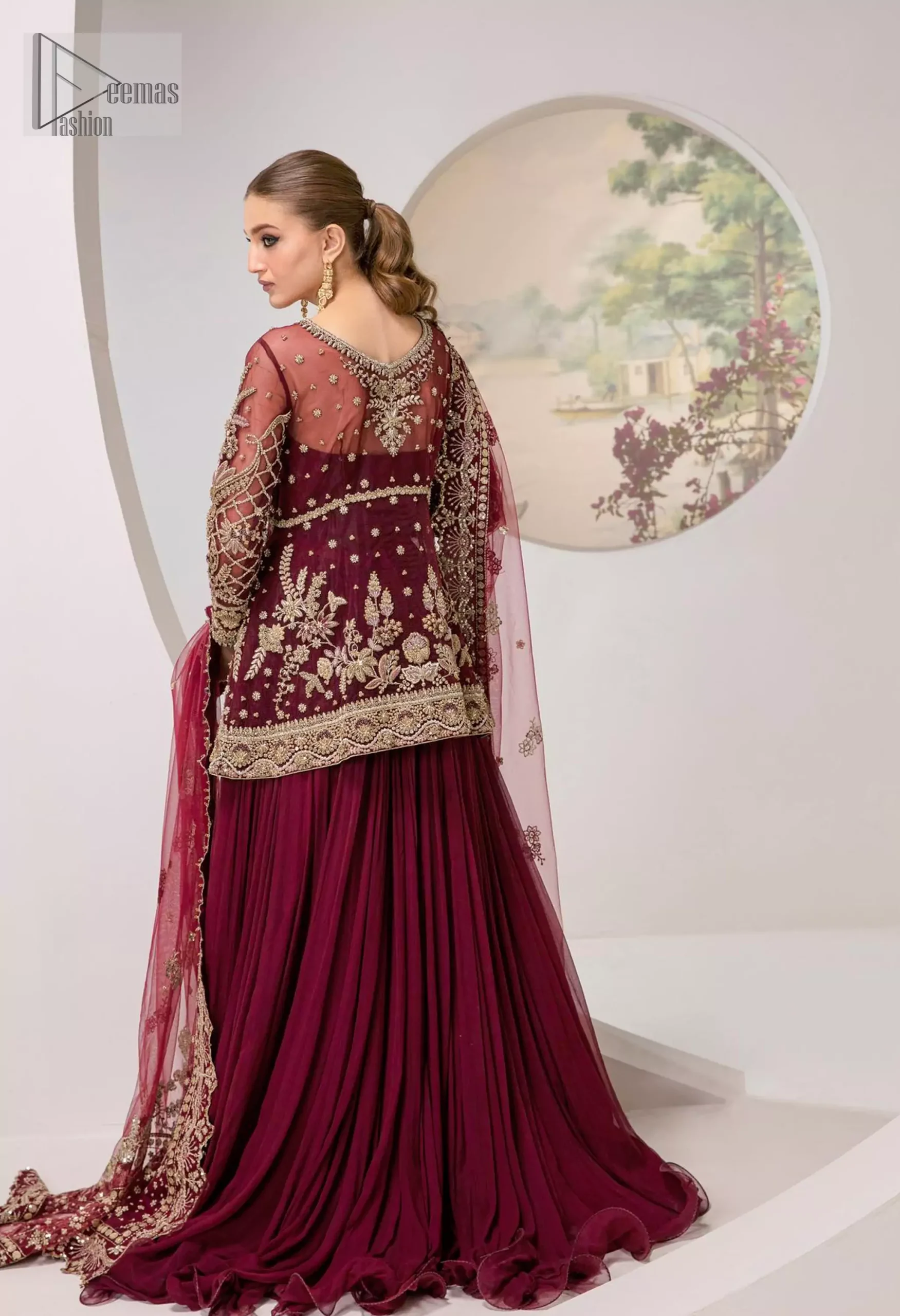 You are introducing our Maroon Party dress, a true embodiment of purity and simplicity for your special ceremony. This elegant ensemble is thoughtfully designed with dark antique shades of embroidery which involves tilla, dabka, Kora, Kundan and minimalist silhouette, allowing your natural beauty to shine on this sacred occasion. Crafted from the finest fabrics, it is organized with an inner maxi, giving you grace as you exchange your vows. The classic heavy dupatta in the same colour symbolizes the essence of the event, while delicate embellishments add a touch of sophistication. Make your union even more memorable with our party wear, perfectly tailored to honour the solemnity of the moment.