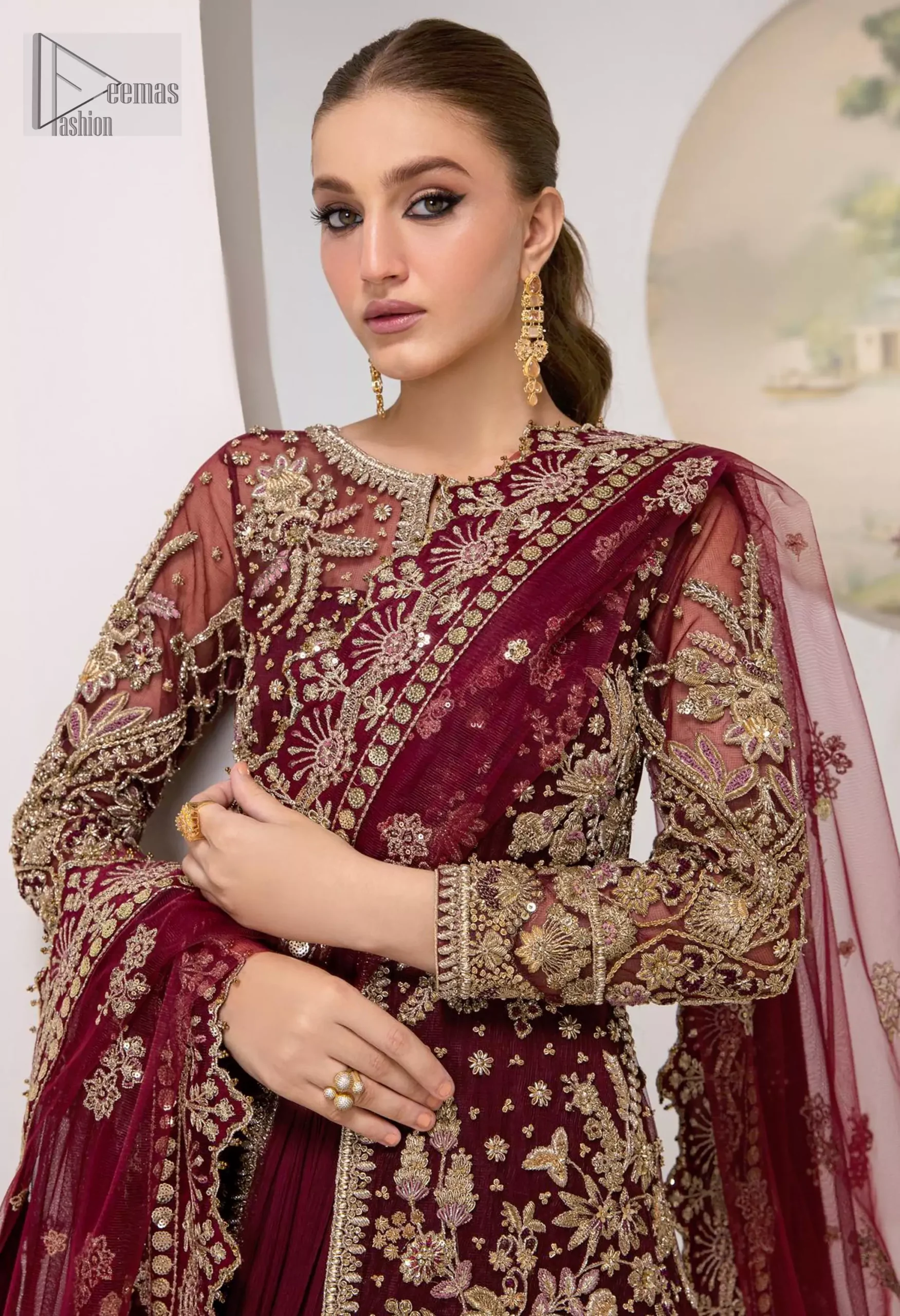You are introducing our Maroon Party dress, a true embodiment of purity and simplicity for your special ceremony. This elegant ensemble is thoughtfully designed with dark antique shades of embroidery which involves tilla, dabka, Kora, Kundan and minimalist silhouette, allowing your natural beauty to shine on this sacred occasion. Crafted from the finest fabrics, it is organized with an inner maxi, giving you grace as you exchange your vows. The classic heavy dupatta in the same colour symbolizes the essence of the event, while delicate embellishments add a touch of sophistication. Make your union even more memorable with our party wear, perfectly tailored to honour the solemnity of the moment.