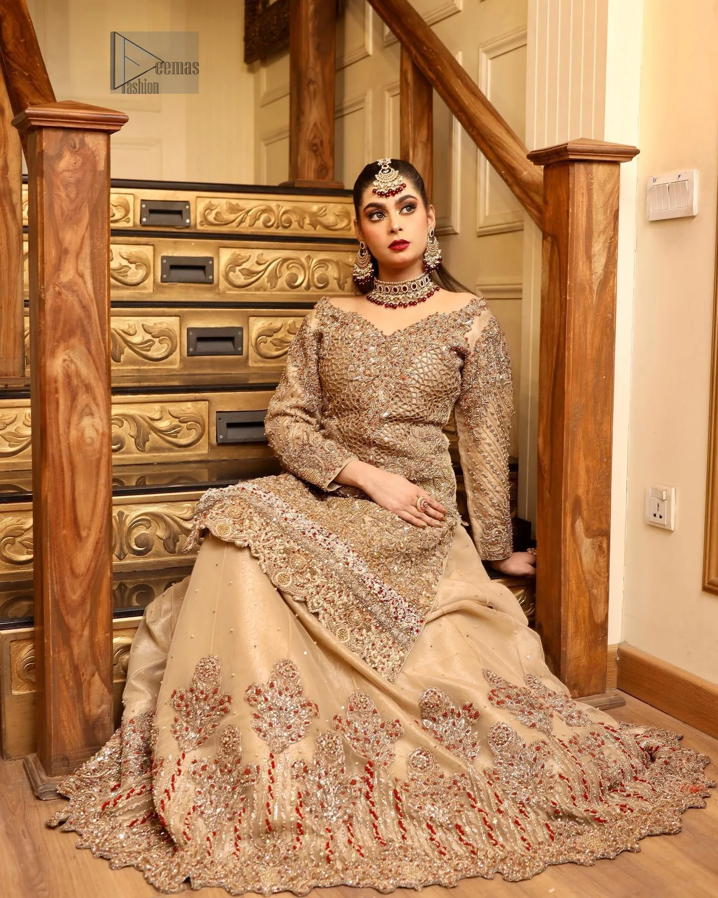 The antique embroidery delicately adorns the beige shirt, while the boat-shaped neckline and full sleeves create a refined, graceful silhouette.