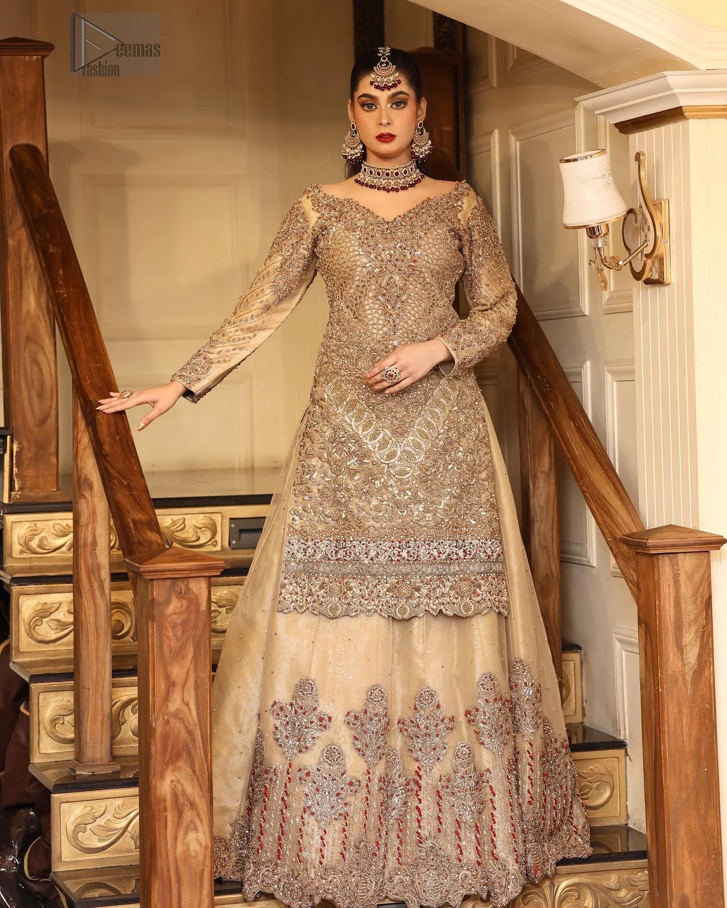 Beige Scalloped Shirt Can Can Lehenga envelops you in understated beauty, perfect for your Nikah day. The antique embroidery delicately adorns the beige shirt, while the boat-shaped neckline and full sleeves create a refined, graceful silhouette.