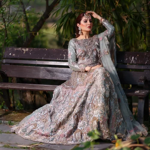 A beautifully scalloped hemline frames the dupatta, completing the look with scattered motifs all over the ground. Mint Green Lehenga