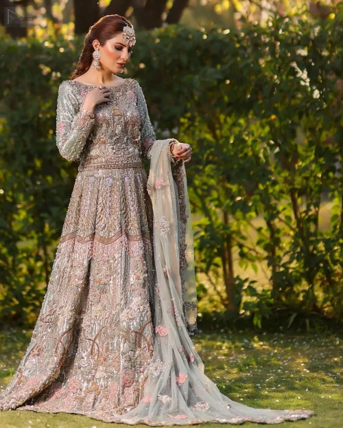 Redefine elegance with the Mint Green Lehenga Blouse Dupatta, a perfect dress for your Walima. This stunning ensemble features a