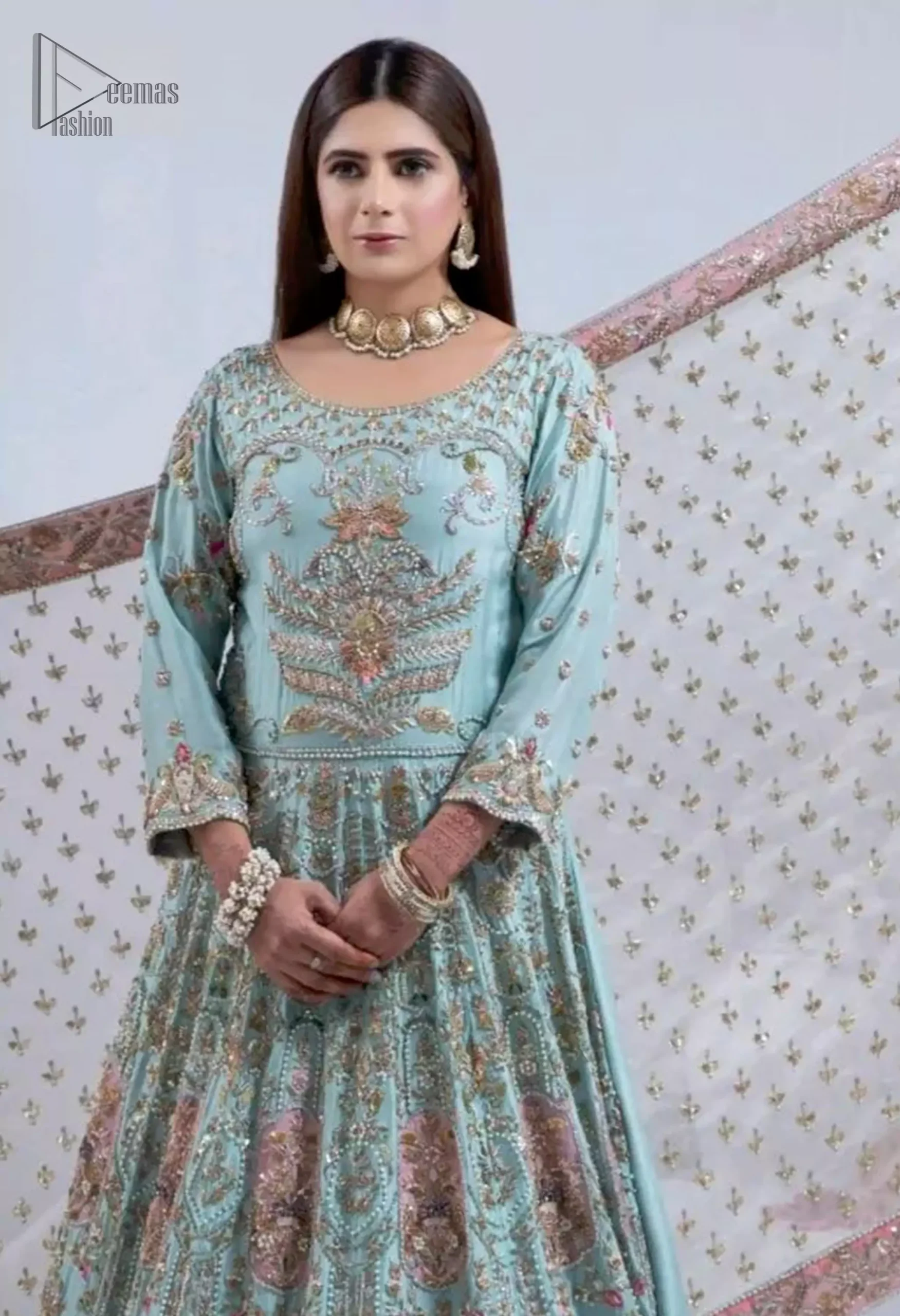 The soft Aqua hue pairs beautifully with the Ivory accents, creating a stunning contrast. The dark antique and dull golden embroidery shades artistically enhance the fabric. Featuring intricate appliqué details that add depth and texture.