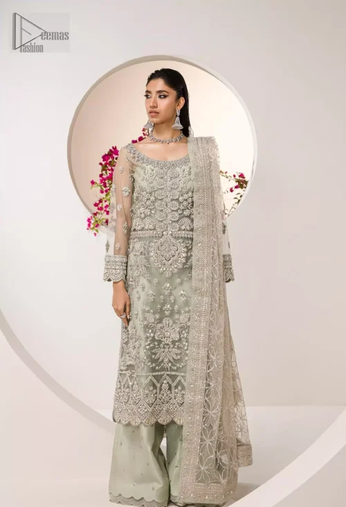 Paired with flowy palazzo pants, this outfit blends tradition and contemporary chic. The delicate mint hue exudes freshness, wrapping you