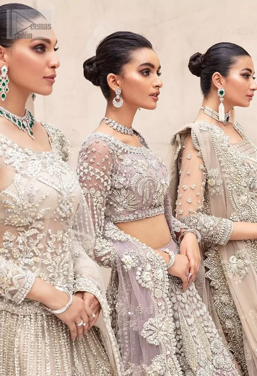 The chic short blouse, with its sophisticated boat neckline and sleeves, brings a modern touch, while the flowing lehenga embodies