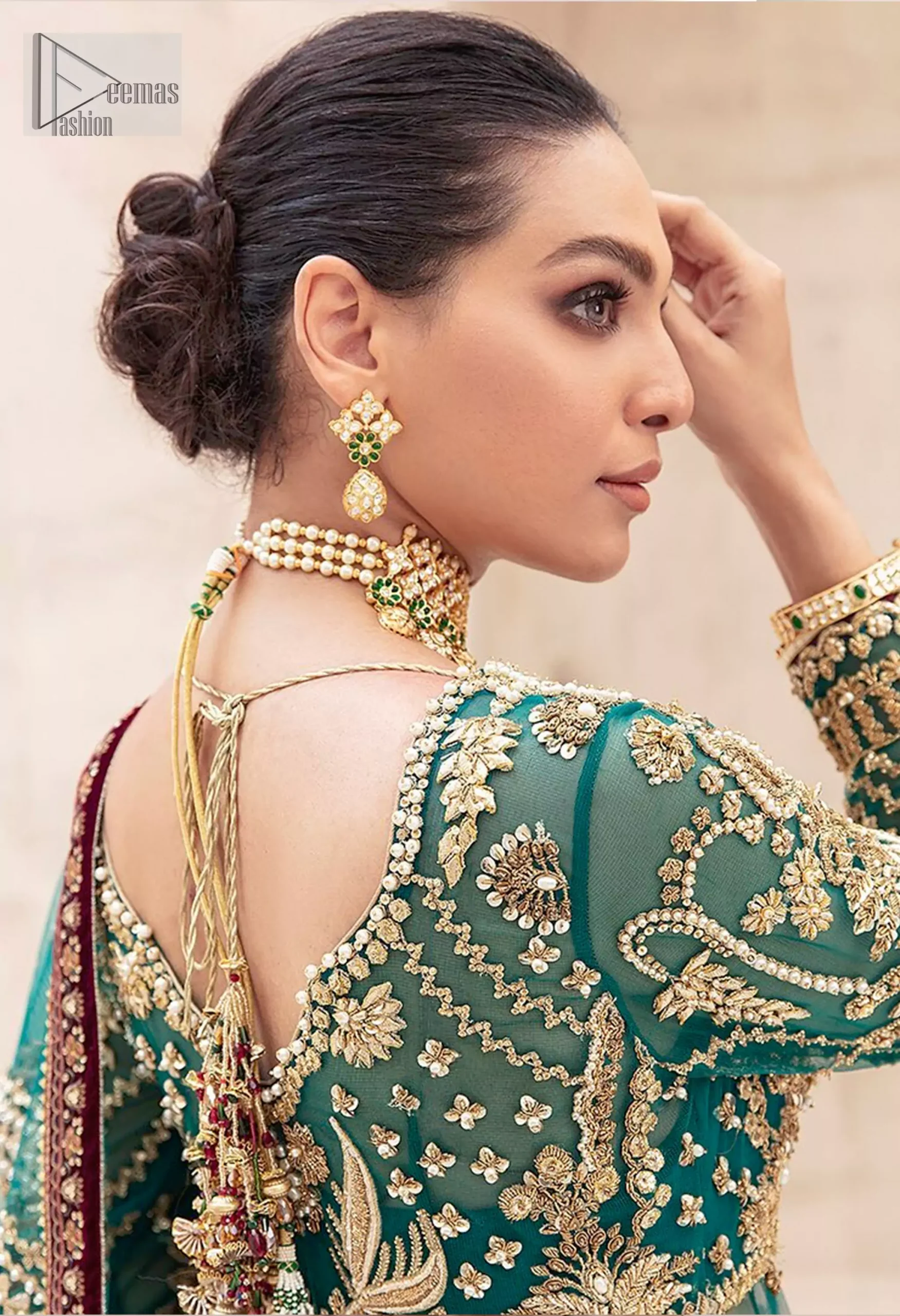 Complete the ensemble with a dupatta adorned with intricate embroidery, featuring scattered floral motifs and finished with four-sided maroon appliqué detailing.