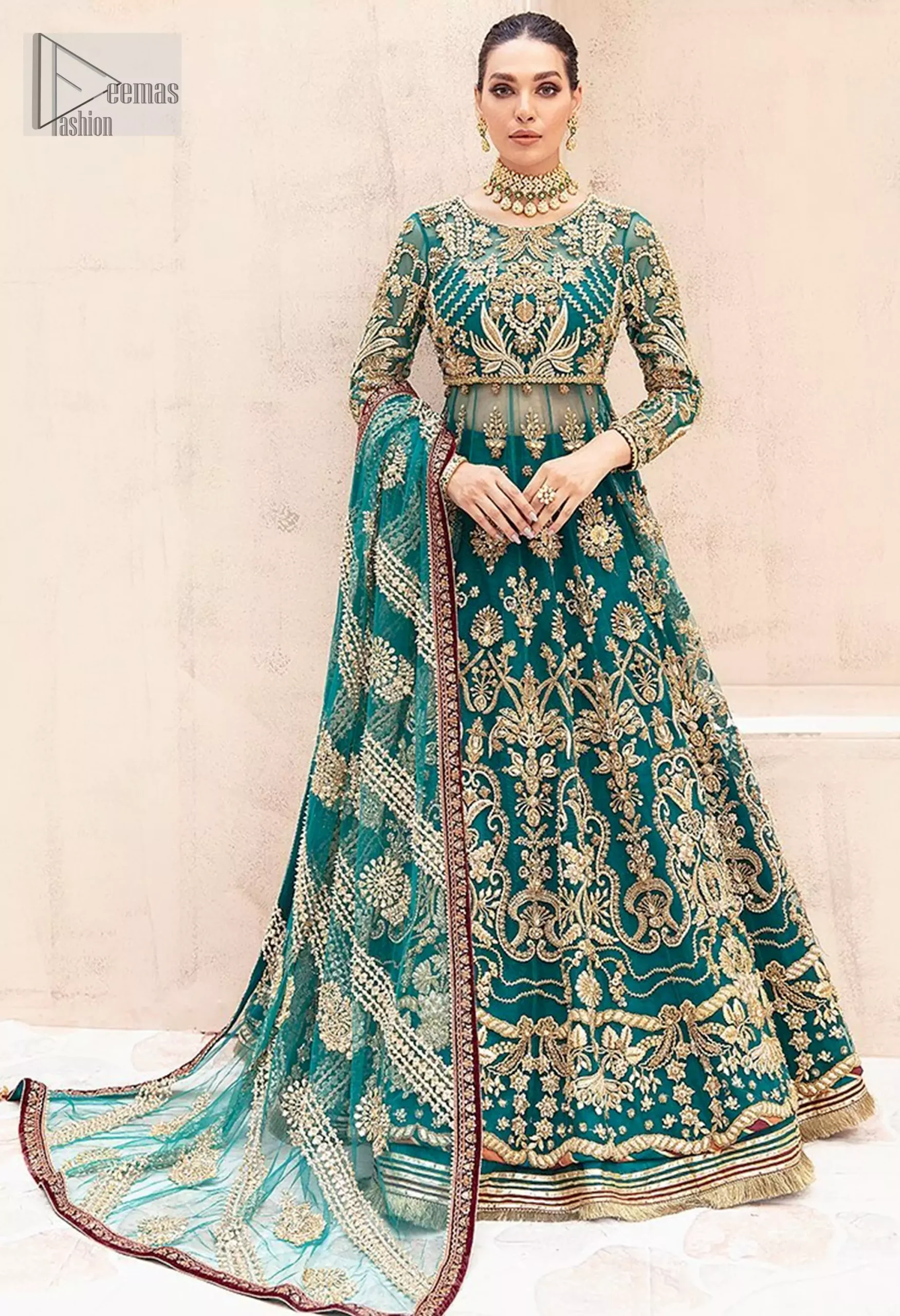 The full sleeves and classic round neckline enhance its timeless charm. Complete the ensemble with a dupatta adorned with intricate embroidery.