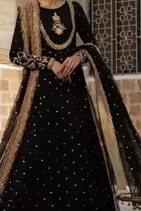 Expansive lower hemline and flare of the black organza party pishwas.