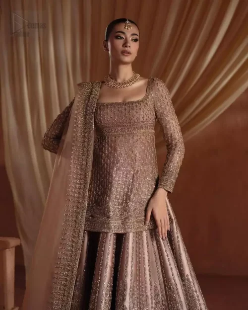 Square Neckline Detail: Close-up of the graceful square neckline on the golden shirt, showcasing the unique and sophisticated tan embroidery.