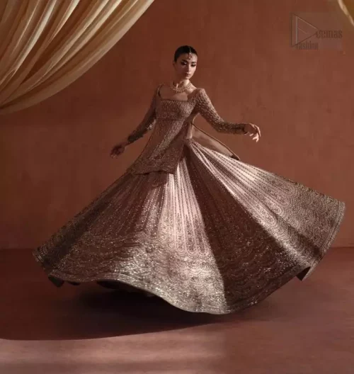 Wide Flare Perspective: Capturing the majestic volume of the flared golden lehenga, highlighting the luxury of 100% pure tissue silk.