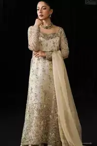 Ivory long shirt sharara dupatta set in organza, featuring silver & golden embroidery, side-open design, and round neckline. Ideal for Nikah dresses, weddings, and formal events. Embrace elegance with this timeless ensemble.