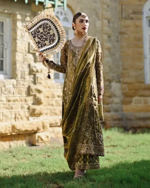 An elegant olive green ensemble featuring a long shirt and palazzos, enriched with intricate silver-gold embroidery on luxurious jamawar and